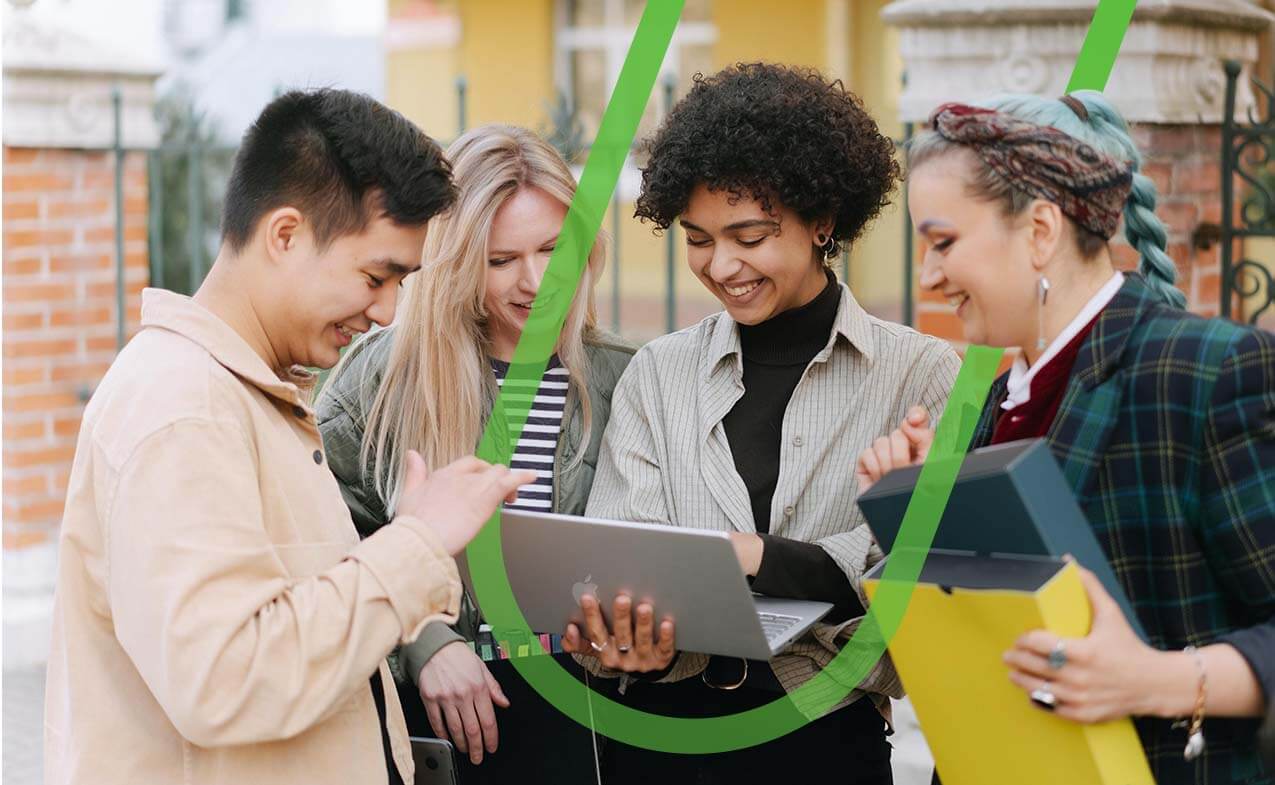 Students looking at laptop